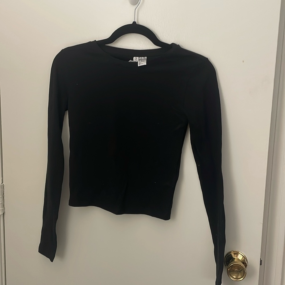 Basic black long sleeve top. Slightly cropped